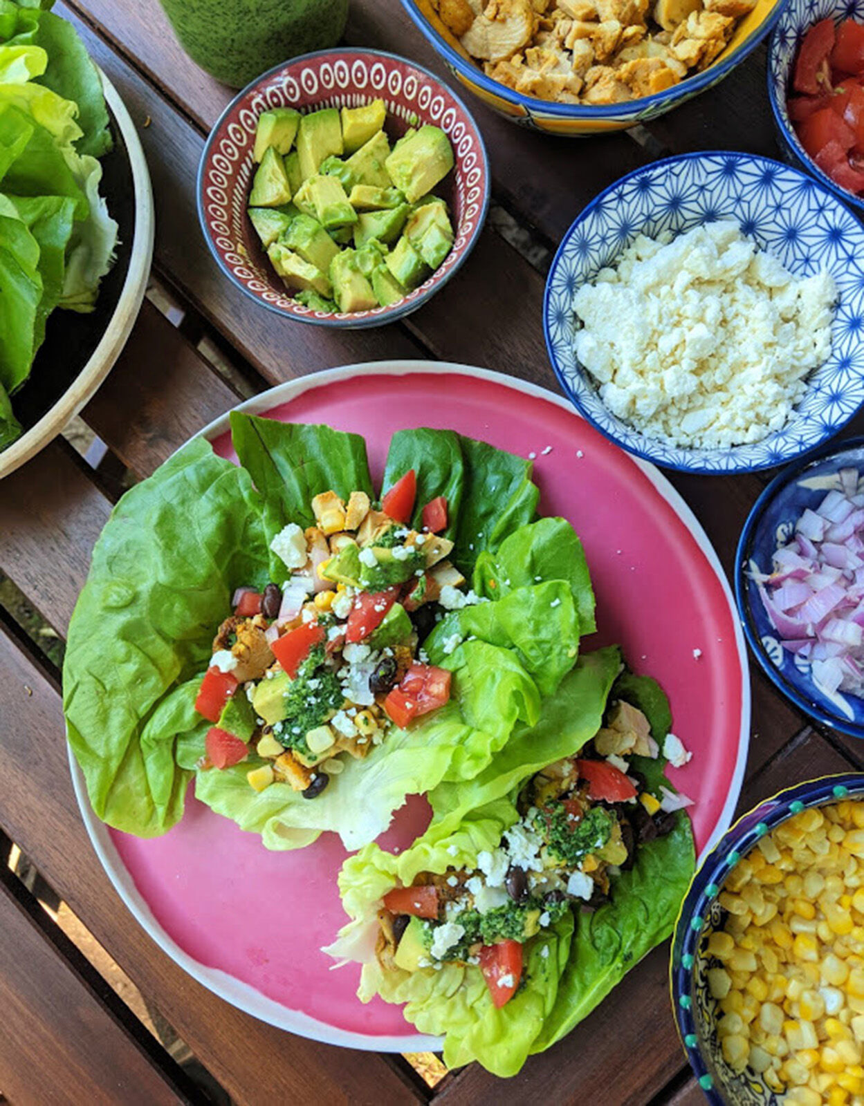 Chicken taco lettuce cups are a hand-held take on the popular Mexican 7- layer dip served at parties.